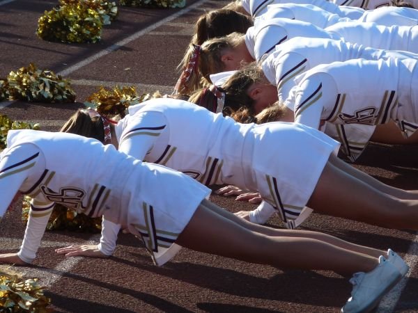 Pointers cheerleaders doing 22 push ups following a score