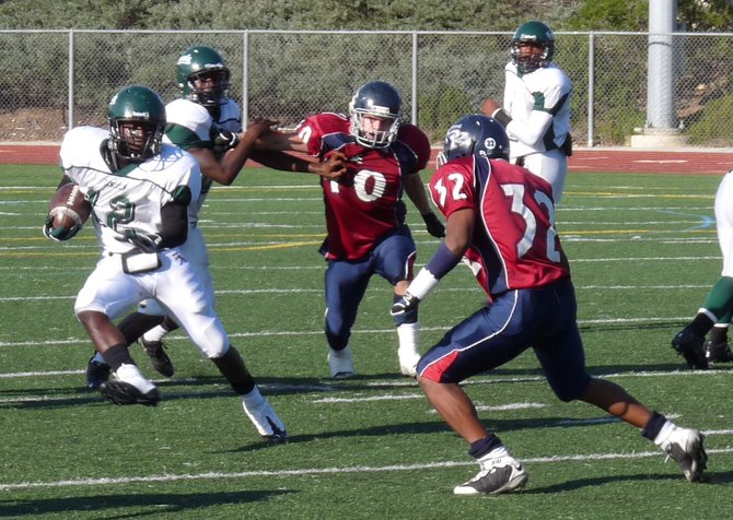 Lincoln running back Jonathan Simpson tries to cut outside Scripps Ranch defensive back Darrell Nash