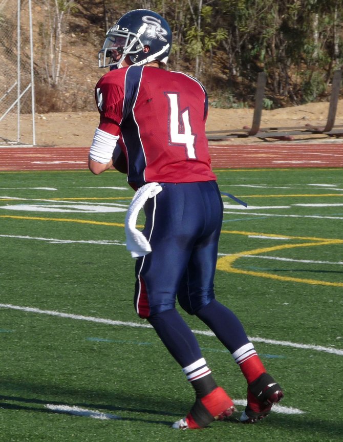 Scripps Ranch quarterback Tate Forcier looks downfield from the pocket