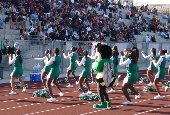 Lincoln cheerleaders try to fire up the road crowd