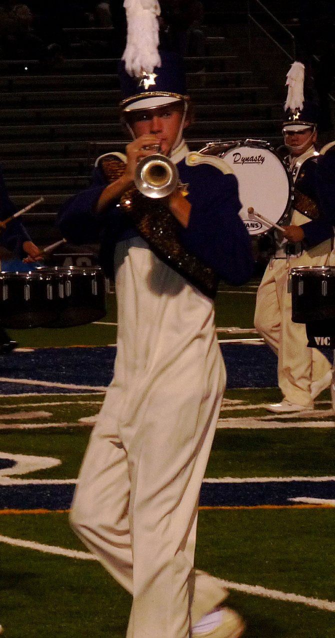 A member of Carlsbad's band plays the trumpet during their halftime performance