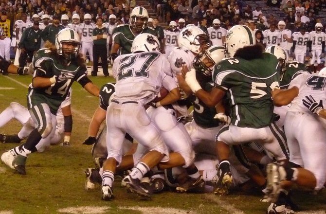 Helix running back Jo-Jo Phillips stuffed at the line of scrimmage by the Oceanside defense