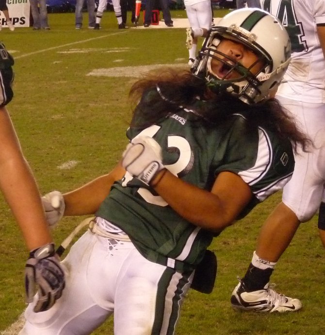 Oceanside linebacker No. 43 celebrates a Pirates stop in the fourth quarter