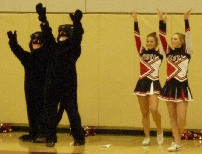 Vista cheerleaders and the Panthers mascots celebrate a basket