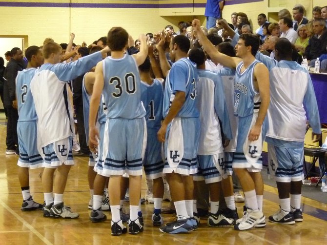 University City players huddle before the start of the third quarter