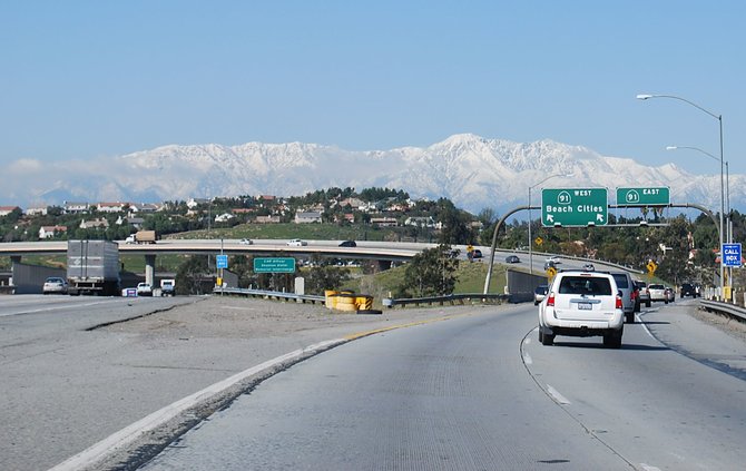 I feel this photo captures the very essence of Southern California living. The beautiful, snow-laden mountains are framing a sign which reads "beach cities."
