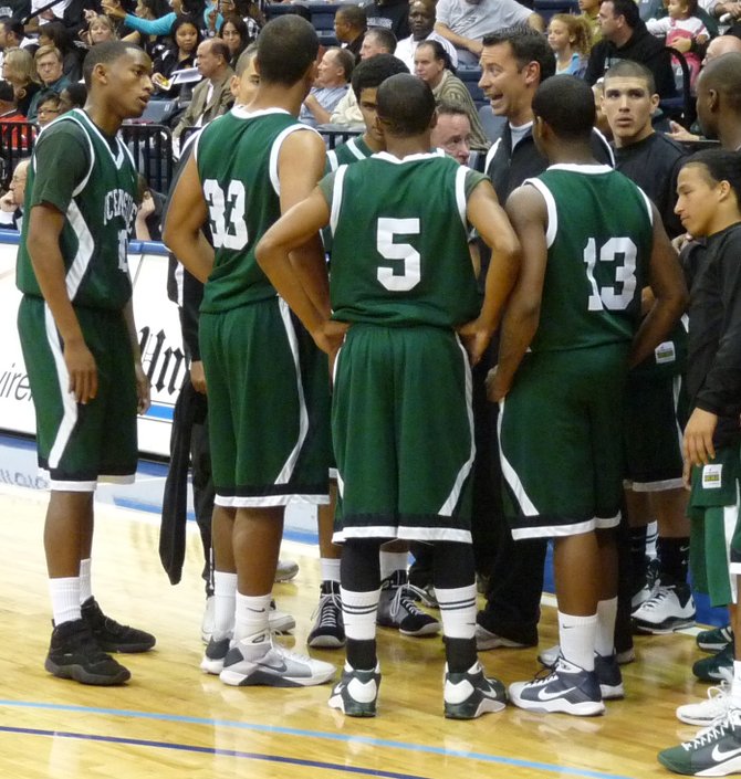 Oceanside coach Corey Houge addresses the Pirates during a timeout