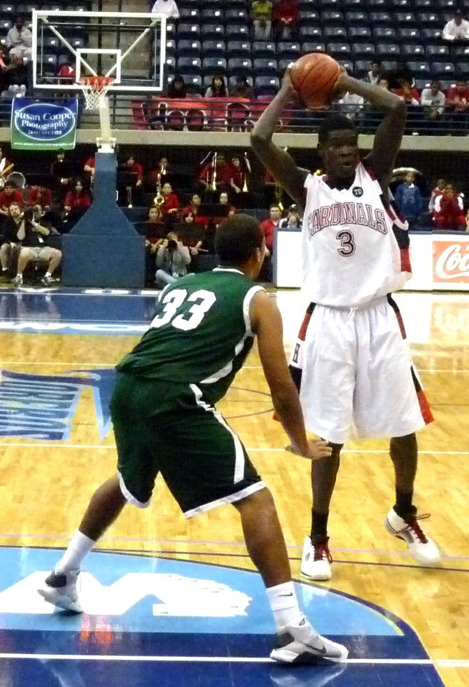 Hoover center Angelo Chol looks for an open teammate