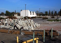 The demolished College Center shopping center at 6300 El Cajon ("The Box") Boulevard awaits its fate. The 10.59-acre site was slated to be transformed — in 2003 — into an urban neighborhood with about 400 homes and opportunities for retail shops, one of the "urban villages." Objections to the inclusion of low-income housing and tight money have left this prime real estate looking like a field inhabited by giant gophers.