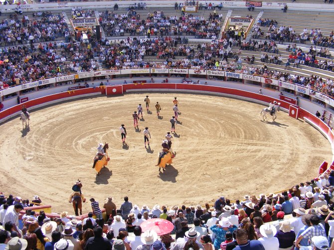 The master of ceremonies, the matador, the rejoneador, and the cuadrilla opening the ceremonies at a bullfight in Playas de Tijuana.

