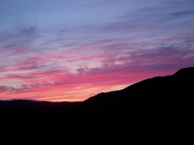 This is a June sunset over the hills northwest of Lake Hodges after several days of drizzling rain clouds.
