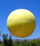 The hot air balloon ride at the San Diego Wild Animal Park hovers gracefully over the Heart of Africa Exhibit like a giant fried egg …