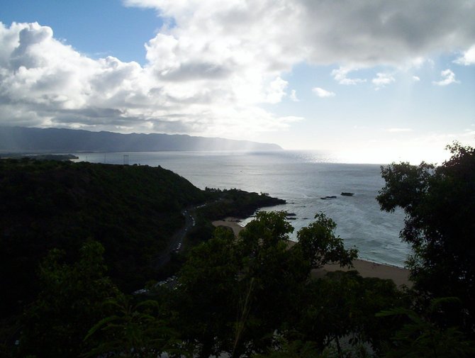 Looking towards the western tip of Oahu from a bluff over the North Shore. 

