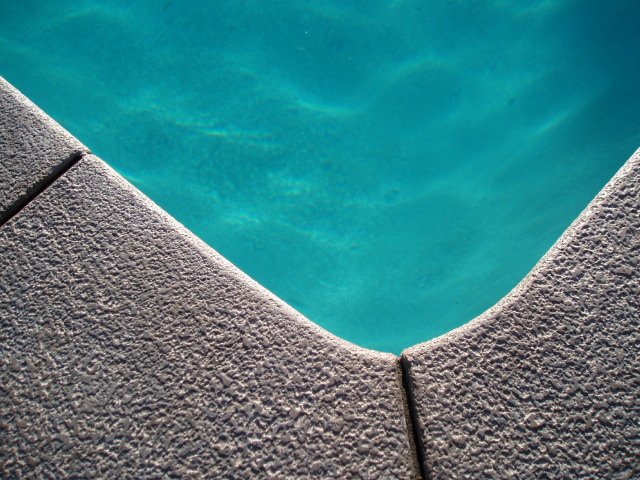  This photo, of the edge of our kidney shaped swimming pool, was taken at the Caliente Tropics Resort in Palm Springs, a super cool, mid-century Hawaiian-themed motel. I thought it was very simple, yet so inviting. 