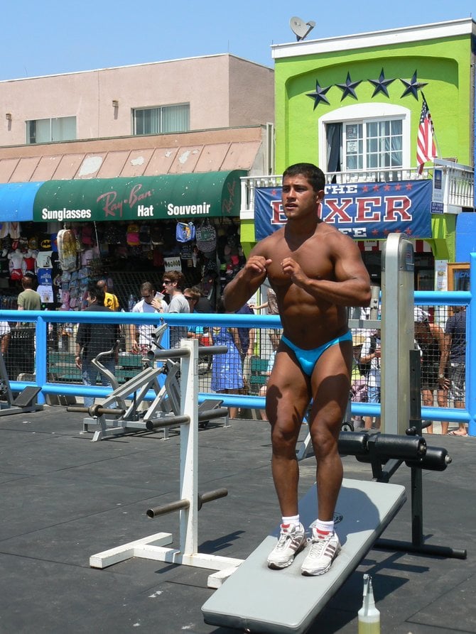 Muscle man working out, Muscle Beach, Venice, CA 
