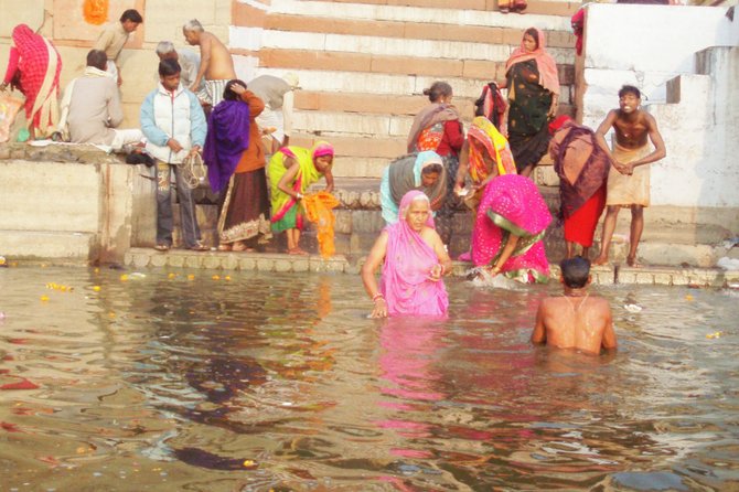 These are early morning bathers at the Ganges River in Varanasi, India.