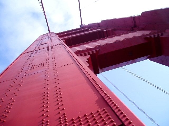 On a trip to Northern California earlier this year, we drove across the Golden Gate Bridge. On the North East side of the bridge there is a free parking lot from which you can take some wonderful photos of the span of the bridge as well as the city. I walked out onto the bridge and took this photo from directly under the Northern
suspension structure.  