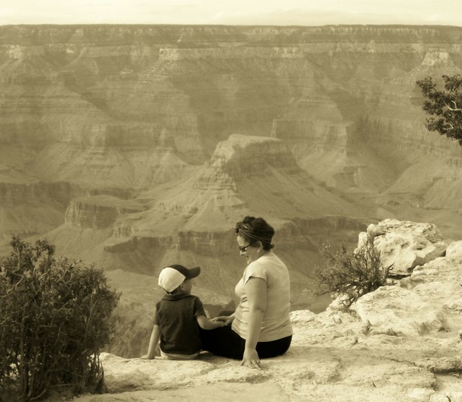 My son and I sat down to take in the afternoon glow of the Grand Canyon. It was surreal because at one point he put his hand in my lap and looked up and said "I love you mommy, thank you for bringing me here," my husband caught the moment on cemera and I will forever treasure the moment, the memory and the photo.
