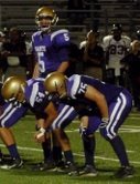St. Augustine quarterback Evan Crower surveys the defense at the line of scrimmage

