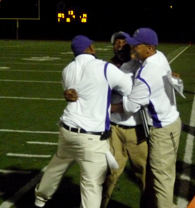 St. Augustine coaches celebrate the school’s first ever win over Carlsbad