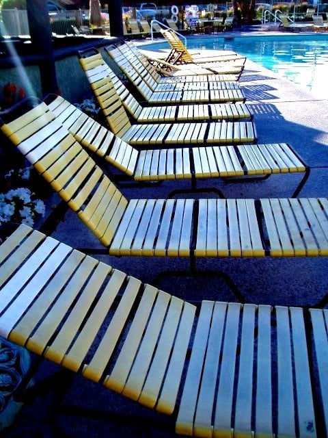 This row of poolside lounge chairs at one of the Palm Springs resorts is the ultimate loafer's paradise. This is where I would love to be right now, despite the summer heat. A desert vacation can't be beat, even if you just lounge the day away.