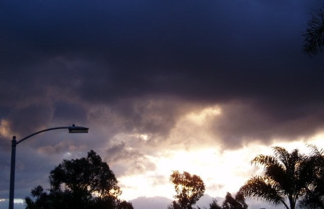 Due to the unfortunate circumstances of the wildfires in Los Angeles county, which left a lot of particulate in the air, coupled with the fact that San Diego county had enormous thunder clouds in the north east skies at the same time, this photo, which was taken in front of a friend's home in Vista, turned out like it this.  