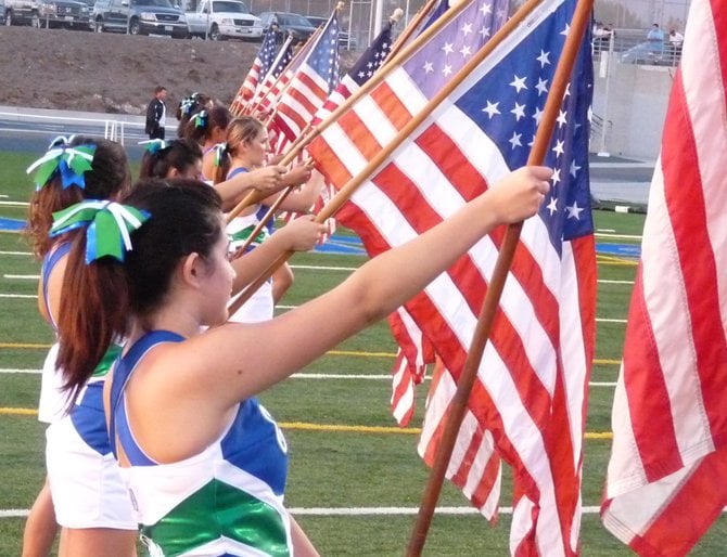 Photo: Eastlake cheerleaders hold American flags during the national ...