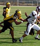 Mission Bay defensive end Dominique Peirson drags down Paloma Valley quarterback Caleb Ennis