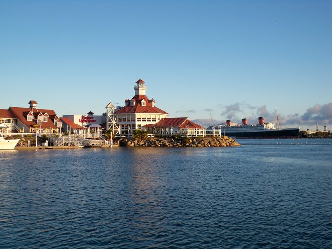 Parker's Lighthouse Restaurant with the Queen Mary in the background in Long Beach harbor. 
