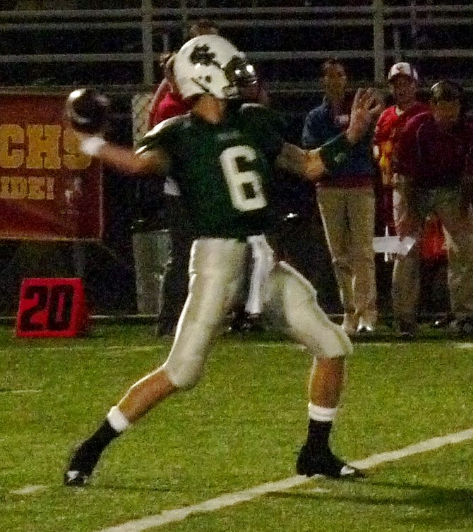 Helix quarterback Jake Reed fires a pass downfield