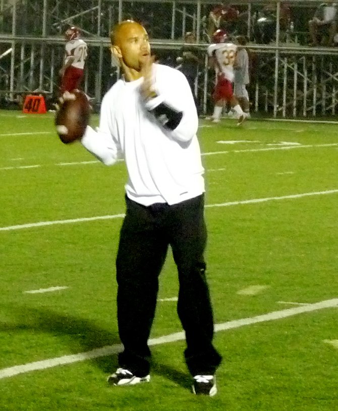 Helix assistant coach and former Chargers receiver Eric Parker throws a pass at halftime