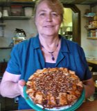 Judy, the pie lady, holding an apple-caramel-pecan pie, Apple Alley Bakery & Coffee, Julian, CA