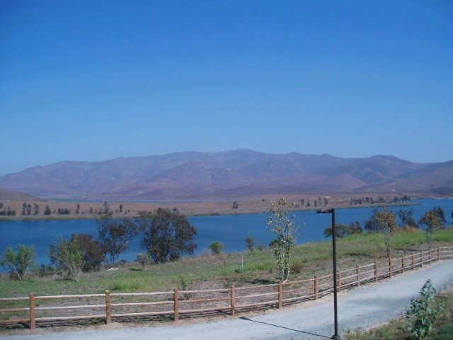 Mountain Hawk Park in Chula Vista overlooks Lower Otay Lake. The name of the park pays homage to the fact that the area is haven for birdwatchers. The 13 acre park has a very cool "spitting fountain" water feature for the kids to run through, several large covered picnic kiosks, an ampitheater, brand new playground equipment (for both big and little kids) and several multiuse sports fields. And there's plenty of grass for just running around. The park has some very nice bronze sculptures of the local wildlife for an artistic touch. And there's a lovely paved  trail that hugs the lakeshore for walking and biking if you're so inclined.