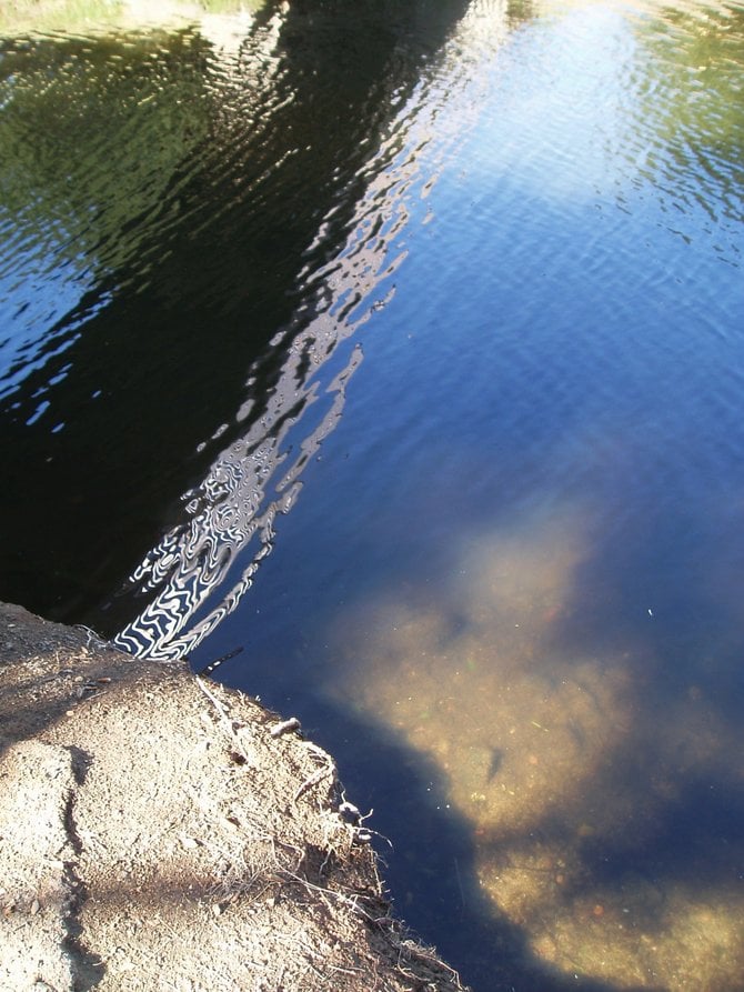 A reflection of a bridge over one of the seven lakes at Santee Lakes. It's peaceful place to come for self-reflection during the week when there are no crowds. 