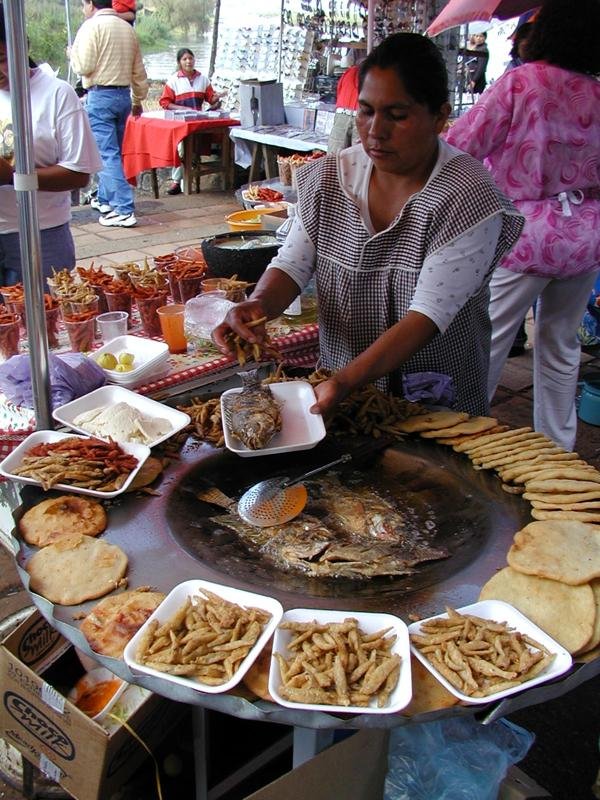 Day of the Dead Street Vendor, frying the little fishes from the lake, Patzcuaro Lake, Michoacan, Mexico