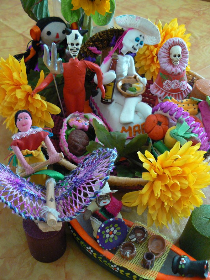 Mexican "Offerta" with sugar figures and marigolds, for The Day of the Dead, Oceanside, CA