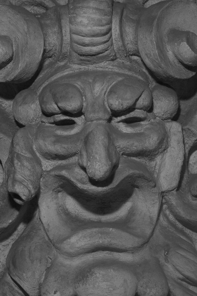 Statue with happy face at Balboa Park.