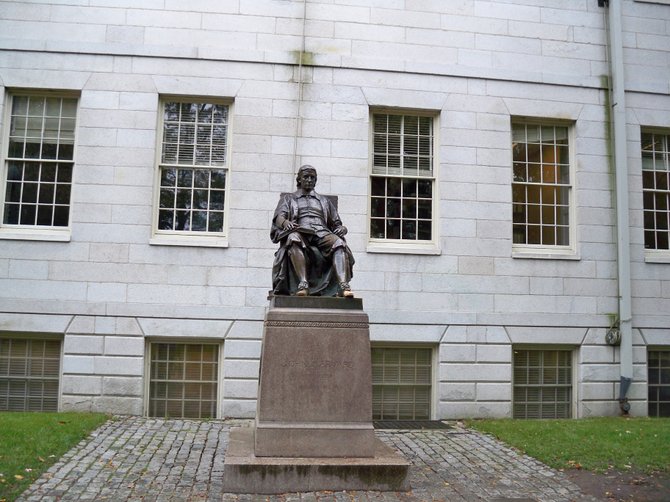 The John Harvard Statue at Harvard University in Cambridge, MA.