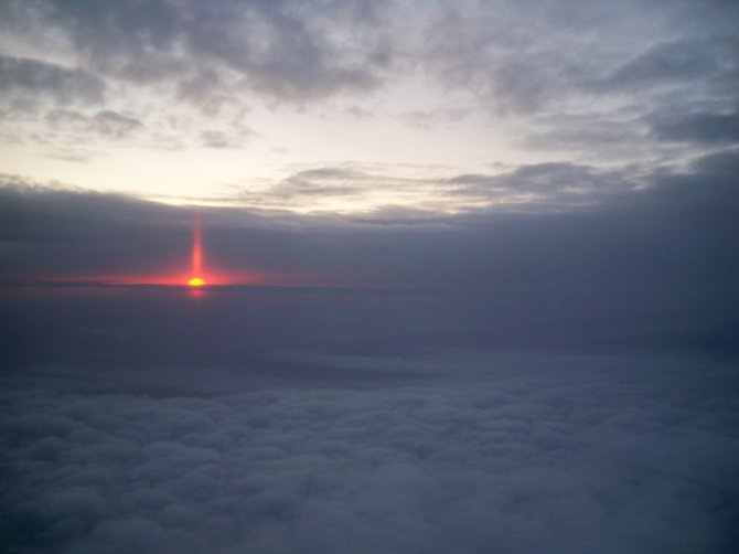  The sun setting over the clouds somewhere over Pennsylvania. 35,000 feet.  