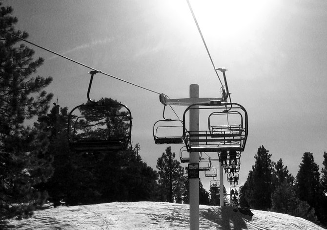 Chairlift on snow summit.