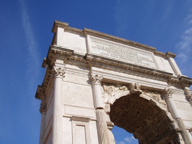 The Arch of Titus on a clear day in Rome, Italy.