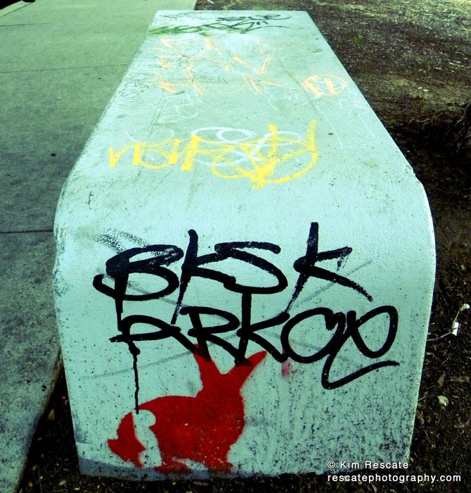 Graffiti on a bench.