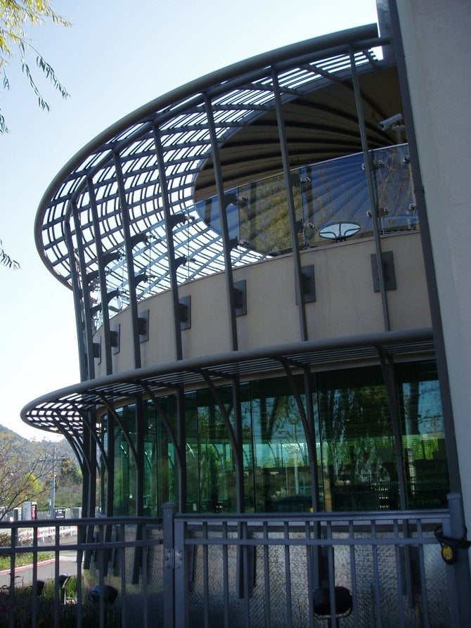 This glass and metal circular structure serves as the back porch for the Mission Valley Library. The library has an upstairs loft featuring both indoor and outdoor sitting areas. It's a gorgeous,
restful place to enjoy a good book or to use your laptop to write reviews for the San Diego Reader. 