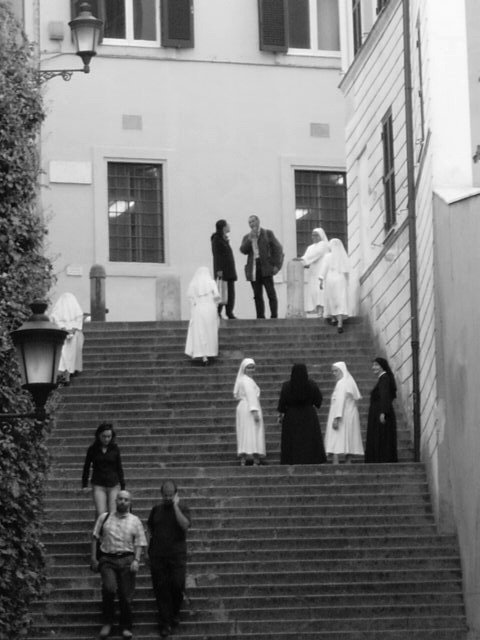 Walking down the street in Roma, Italia, I looked over and noticed these nuns walking up the stairs. As I pulled out my camera, three of them turned and 'posed' for me without meaning to.