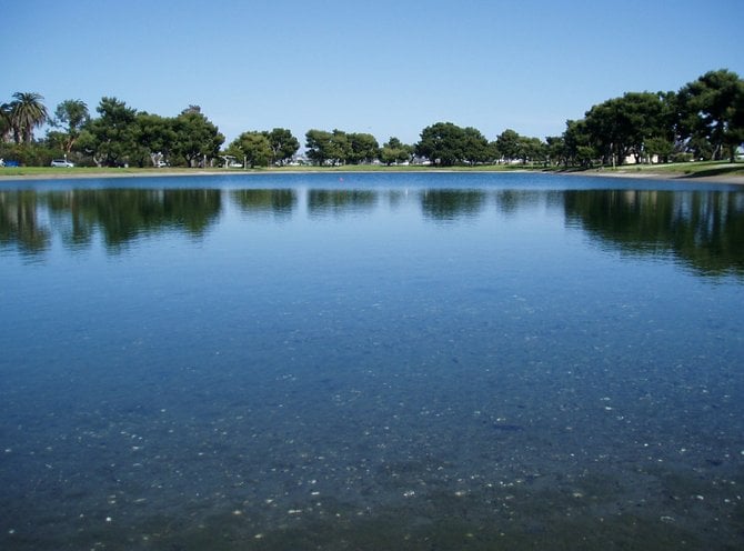 This is the model yacht pond on Vacation Isle in Pacific Beach on a pristine Monday morning. The weekend is the best time to check out model boat racing and to chat with sailing enthusiasts. It's a lot of fun for both kids and adults. Bring a picnic and enjoy a day at the races.  
