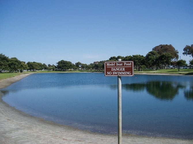 This sign at the model yacht pond in Pacific Beach declares, "No Swimming" which is kind of like giving a toddler a lollipop and then saying, "No licking." The pond was so tempting on this pristing Monday morning. Best to go back on the weekends and partake of the model boat racing. 