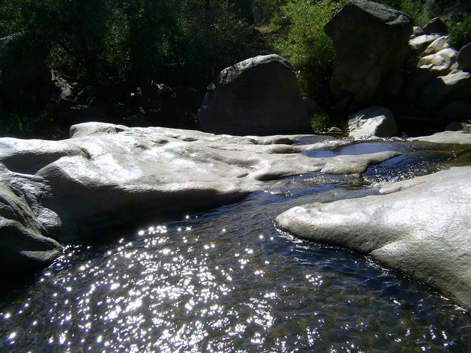 Relaxing view of a stream runoff in Mission Trails Park as the sun reflects off the water.

