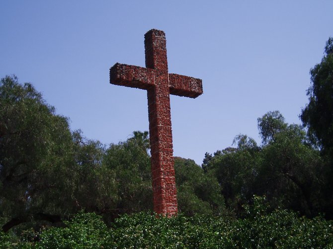The Serra Cross, dedicated on September 28, 1913, was built with tiles excavated from the site of the original fort (presidio) and mission, established in 1769 by Father Junipero Serra.