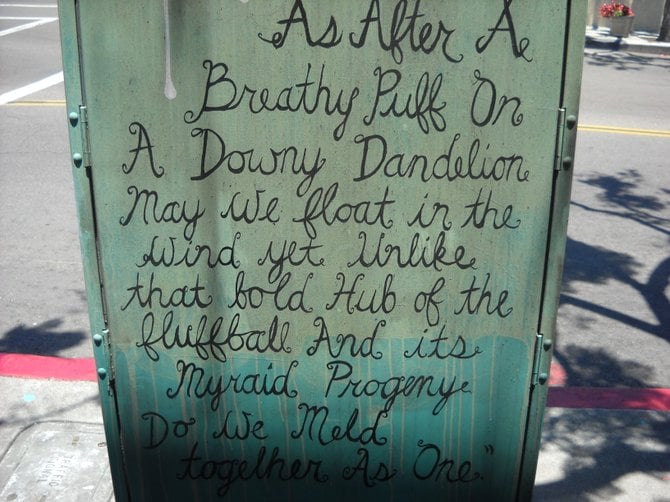 Written prose on a utility box near Canon Street and Rosecrans in Point Loma.
