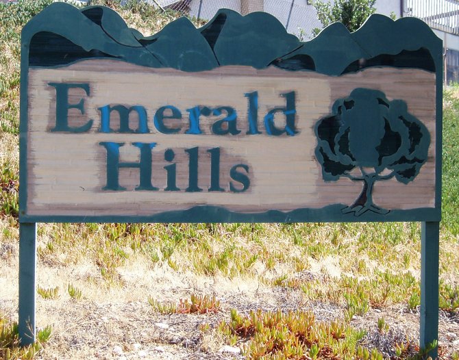 A sign welcoming visitors to Emerald Hills.